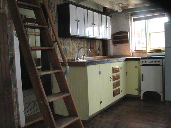 The butcher block counter, sink and stove in loft 3F