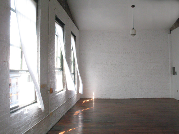 Photograph showing the large windows that fill loft 3F with light