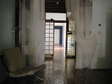 A sliding door leads to the rear of the loft